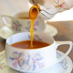 sauce being poured into a tea cup