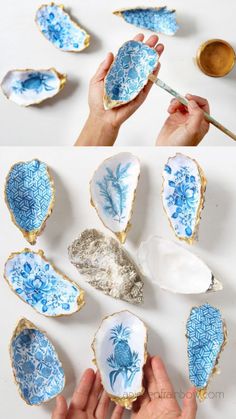 the process of painting blue and white flowers on oyster shells with gold leaf trimmings