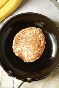 a pancake sitting on top of a black skillet