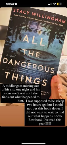 a person holding up a book with the title all the dangerous things written on it