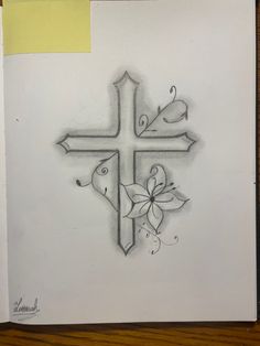 a drawing of a cross with flowers on it