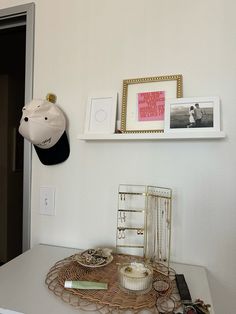 a white table topped with pictures and other items