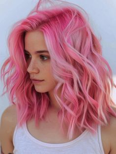 Transform your hairstyle with these 20 pink hair color ideas. From cotton candy hues to bold berry shades, find the perfect pink to express your individual style and creativity. Bright Pink And Blonde Hair, Bubble Gum Pink And Blonde Hair, Bright Pastel Pink Hair, Bubblegum Pink Hair, Pastel Pink Hair Color, Pink Curls, Fall Winter Hair Color, Bubblegum Pink Hair Cotton Candy, Mermaid Hair Blonde Pink