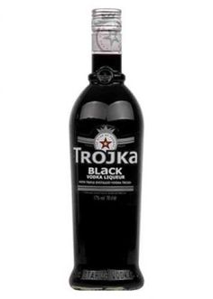 a bottle of trojka black vodka