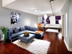 a living room filled with furniture and wooden floors