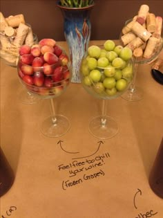 three wine glasses with different types of fruit in them on top of a cork board