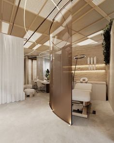 the interior of a modern salon with curved glass walls