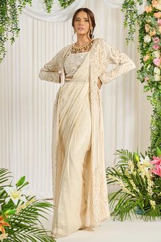 Shop for these amazing collections of Ivory Foil Georgette Embroidery Pearl Subh Bela Cape Saree Set For Women by Nidhika Shekhar online at Aza Fashions. Cinderella Fashion, Saree Jacket, Maggam Designs, Embroidery Geometric, Drape Sarees, Saree Jackets, Jacket Designs, Embroidered Cape