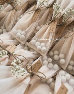 wedding favors are wrapped in organes and tied with twine