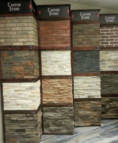 several different types of stone are displayed on the wall