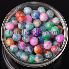 colorful marble beads in a glass bowl on a black background with the words bead party written below it