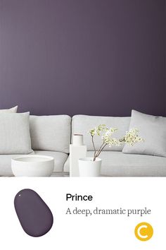 a living room with purple walls and white furniture in the center, as well as an advertisement for deep purple