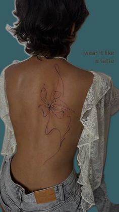 the back of a woman's body with a butterfly tattoo on it