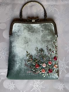 Minty velvet handbag with roses embroidery , velvet handbag, silk roses embroidery,made in our studio  ❤️ *Our handmade rose embroidered minty velvet handbag  *Great gift for yourself or your loved ones.  *romantic piece for girls or women *embroidered with Moulin thread and silk  *Elegant and stylish, unique, one of a kind vintage style velvet handbag is perfect just for you! *Super easy to use  ⁍ I am open to custom orders and personalization.  ⁍You can choose color, size, and flower to embroider and we can embroider monogram as well. ⁍Text us in messages your desires, you can check out our shop for inspiration and ideas. ⚠The color on the photo may be a bit different from the real model, because of the lighting.  Check out the shipping time below ⬇ 🔸Dimensions / ⁍ 24-25Cm Length of the Cheap Vintage Clutch For Party, Luxury Velvet Evening Bag As A Gift, Elegant Green Bag With Floral Embroidery, Elegant Green Bags With Floral Embroidery, Embroidered Velvet Bag For Gifts, Gift Velvet Bag With Embroidery, Embroidered Velvet Bags Ideal For Gifts, Embroidered Velvet Bag Perfect For Gifts, Embroidered Velvet Rectangular Evening Bag