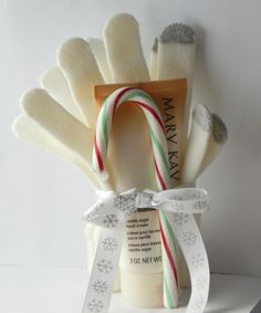 an assortment of personal care items in a gift bag with ribbon and tags on it