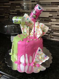 a birthday cake decorated with sprinkles and candy