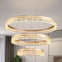 a large circular chandelier hanging over a dining room table