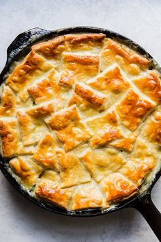 a cast iron skillet with some food in it