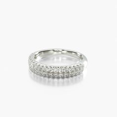 a white gold ring with three rows of diamonds