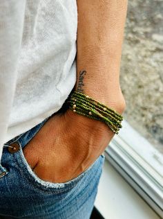 Hunter Green Gold-Sprinkle Beaded 5-Wrap Boho Bracelet – Lady Bird Market Bohemian Green Beaded Bracelets With Gold Beads, Adjustable Green Beaded Bracelets With Gold Beads, Adjustable Green Bracelets With Gold Beads, Green Beaded Bracelet With Gold Beads, Green Bohemian Stretch Bracelet For Everyday Wear, Green Hand-strung Beaded Bracelets, Gold Sprinkles, Boho Wrap Bracelet, Lady Bird