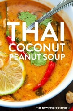 thai coconut peanut soup in a white bowl with limes and red peppers on the side