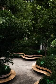 an outdoor garden with benches and trees