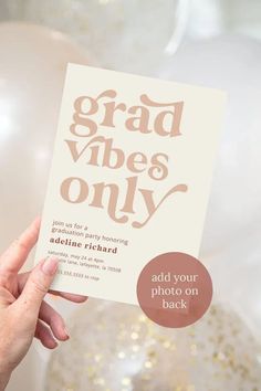 a person holding up a card with the words grad vibes only on it