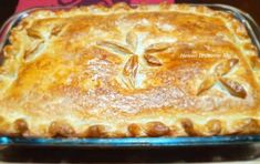 a close up of a pie in a pan on a table