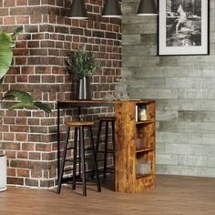 a living room with brick walls and wooden flooring, two stools next to a small table