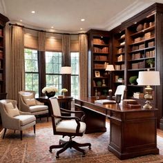 an office with large bookshelves, desk and chairs in the middle of it