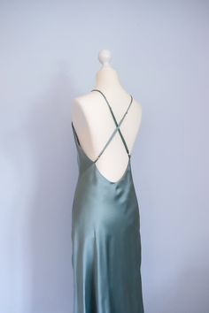 Size: XS - Bust 77 - 79cm - Waist 60 - 62cm - Hip 83 - 85cm - Front length without straps 105cm - color: mystical green   - very simple yet classy and elegant evening dress - wide open back design with adjustable straps - bias-cut design allows the beautiful flare and nuances  - a perfect addition for your minimalistic, refined wardrobe - 100% handmade in Germany with care and adoration, supporting you to uplift your energy and self-loving consciousness Made with 100% mulberry silk charmeuse - Grade 6A - Mulberry silk - 19 momme - OEKO-TEX® certified material Wash care information - Dry cleaning - Cool hand wash - Iron on reverse side - Do not bleach - No tumble dry -No fabric softner Green Formal Slip Dress With Spaghetti Straps, Formal Green Slip Dress With Spaghetti Straps, Green Spaghetti Straps Formal Slip Dress, Fitted Satin Slip Dress With Back Opening, Green Spaghetti Strap Slip Dress For Formal Occasions, Green Silk Evening Slip Dress, Green Silk Slip Dress For Formal Occasions, Green Silk Slip Dress For Evening, Formal Green Silk Slip Dress