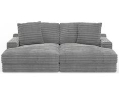 a large gray couch with pillows on the top and bottom, in front of a white background