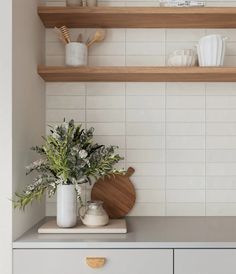 the kitchen counter is clean and ready to be used as a shelf for cooking utensils