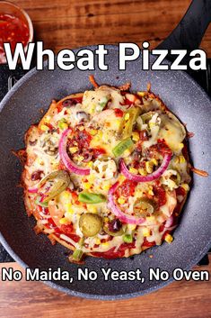 a pizza sitting on top of a pan covered in toppings