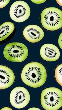 slices of kiwi fruit are arranged on a blue background with black dots and circles