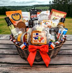 a picnic basket filled with snacks and condiments