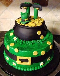 a cake decorated with green and yellow decorations