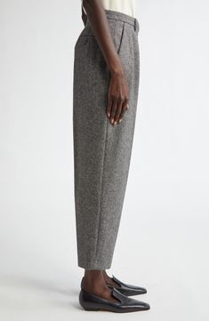 Tailored from rich wool tweed, these tapered-leg pants feature reversed front pleats that create a relaxed fit. 27" inseam; 15" leg opening; 12 1/2" front rise; 17" back rise (size 40FR) Zip fly with hook-and-bar closure Front slant pockets; back button-welt pockets 100% wool Dry clean Made in Italy Designer Clothing Elegant Tweed Bottoms For Business, Elegant Tweed Bottoms For Business Casual, Formal Tweed Bottoms, Elegant Tweed Trousers, Tweed Bottoms With Herringbone Pattern For Workwear, Black Tweed, Welt Pockets, Tapered Legs, Welt Pocket