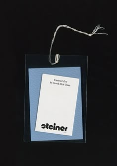 an item with a string attached to it on a black background that says,'efiner '