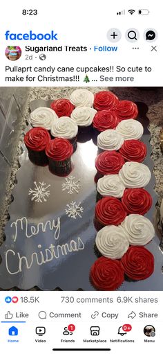 a christmas cake with red and white cupcakes on it, surrounded by snowflakes