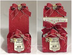 two red boxes with bows and ribbons on them, one has a tag that says merry christmas