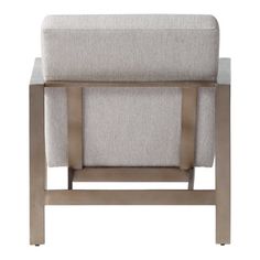 an upholstered chair with metal legs and a beige fabric seat pad on the back