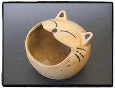 a ceramic cat bowl with its mouth open