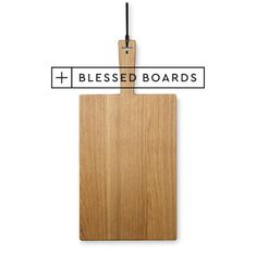 a wooden cutting board with a black cord attached to it and the words blessing boards below