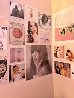 a wall covered in pictures and magnets next to a white wall with pink accents