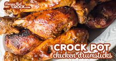 chicken drumsticks on a white plate with the words crock pot chicken drumsticks