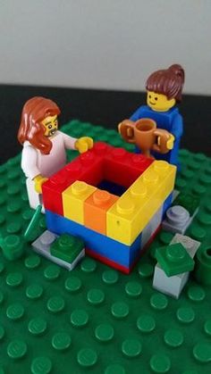 two legos are playing with each other on the table