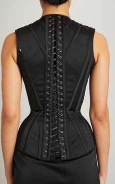 Black double-faced matte satin "Adam" corset with zip-up front and lace-up back As seen in the Fall/Winter '24 lookbook Front zip, fitted Unlined Composition: 100% Recycled Polyester Color: black Zip fastening along front with buttons Made in United States of America Black Adam, Matte Satin, Zipper Detail, Corset Top, Moda Operandi, States Of America, Zip Up, The Black, Zip Ups