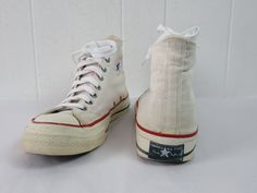 "Vintage 1960s or 70s Converse Chuck Taylors, Chucks hi top basketball shoes. The classic shoe. Made of white canvas. Originally had red laces(included), but I replaced with new vintage white laces. Heel label reads: Converse All Star Chuck Taylor Made in U.S.A. Size 11. Actual measurements are: 12.5\" toe to heel across the soles 4\" across the soles widest point (ball of the foot) In very good condition with some dye from the red laces on the tongue." Chuck Taylors Converse, 1970s Shoes, 70s Converse, Converse Chuck Taylor 70, Converse Vintage, Charlie Spring, Chuck Taylor 70, Converse Hi, Vintage Converse