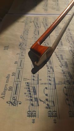 an old violin resting on sheet music